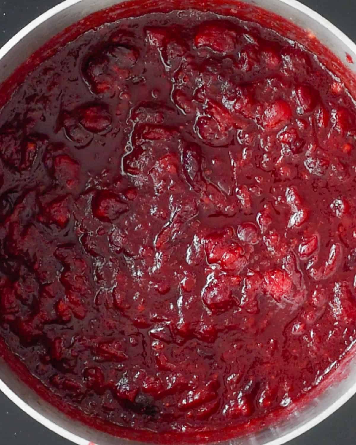 final healthy cranberry sauce mixture in a saucepan. 