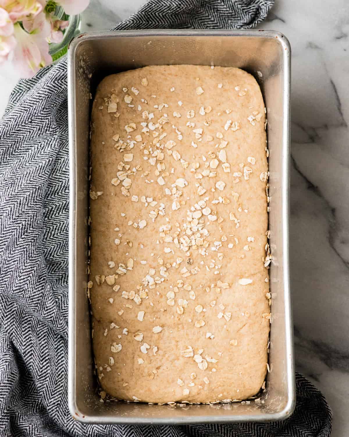 How to Make Honey Wheat Bread - dough in a loaf pan before rising