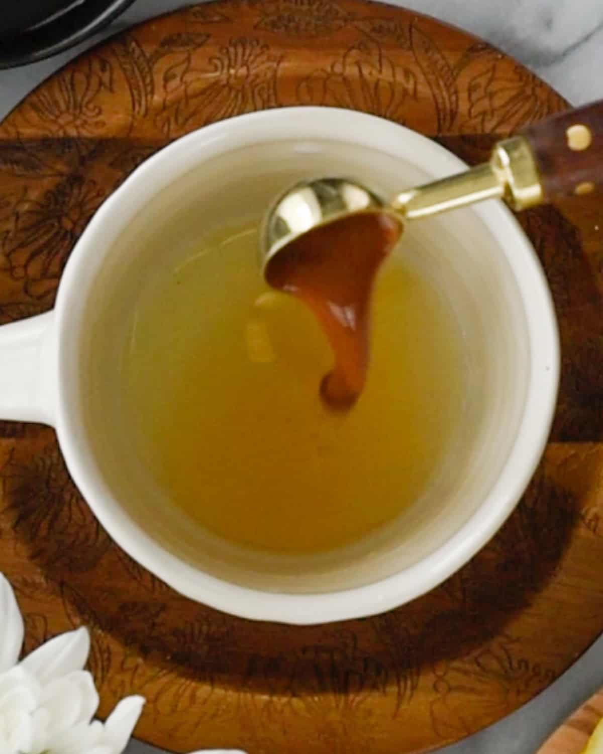 How to Make Immune Boosting Tea adding apple cider vinegar