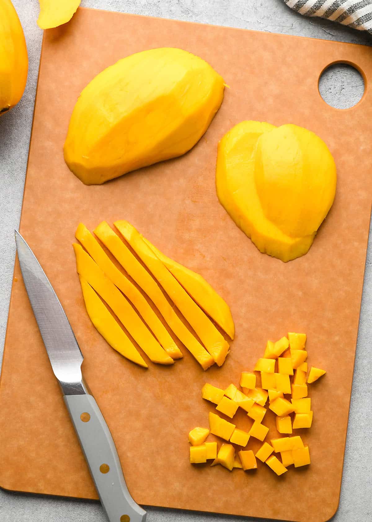 How to make Mango Salsa - cutting mango on a cutting board