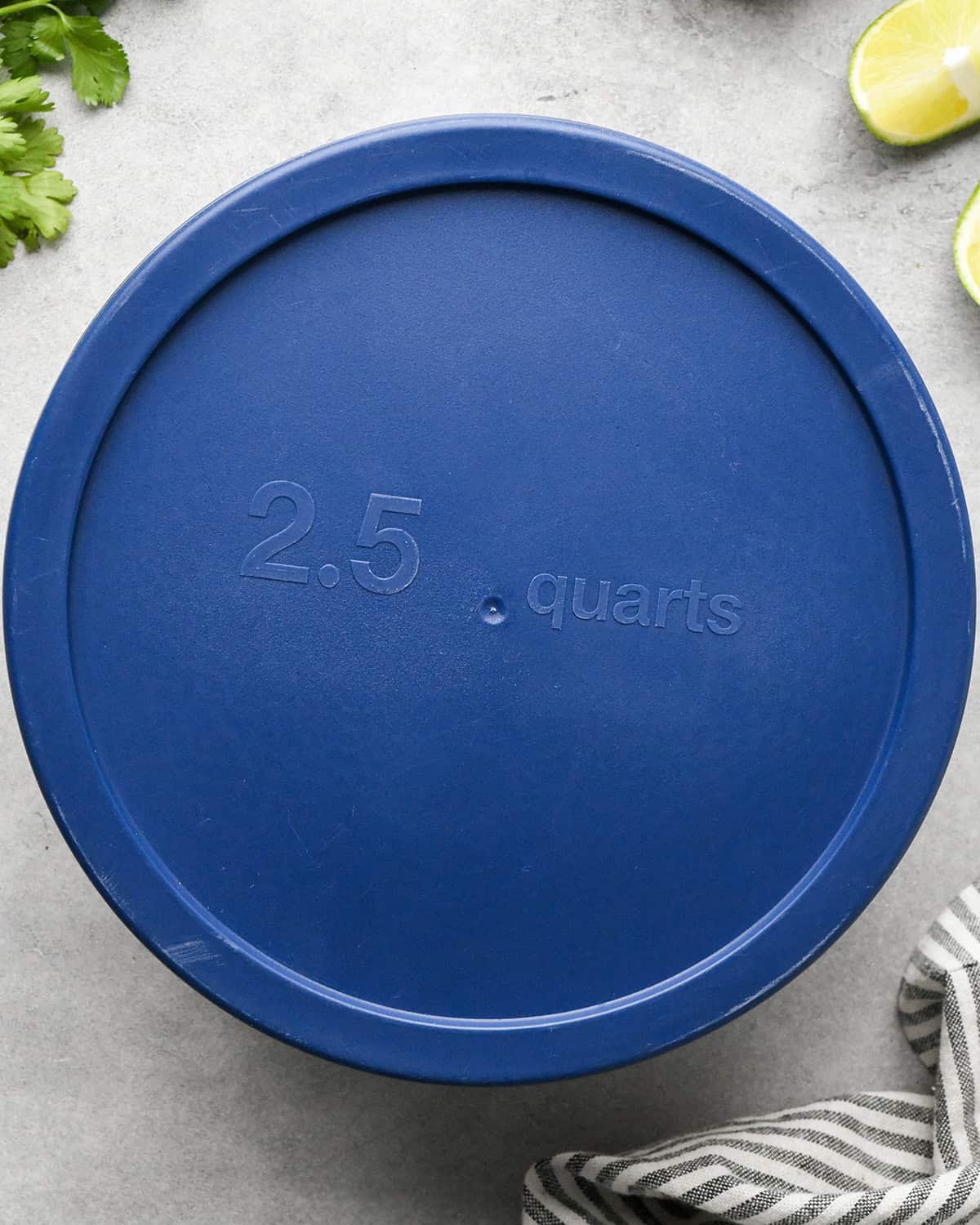 lid on the container of mango salsa to put in the fridge to chill