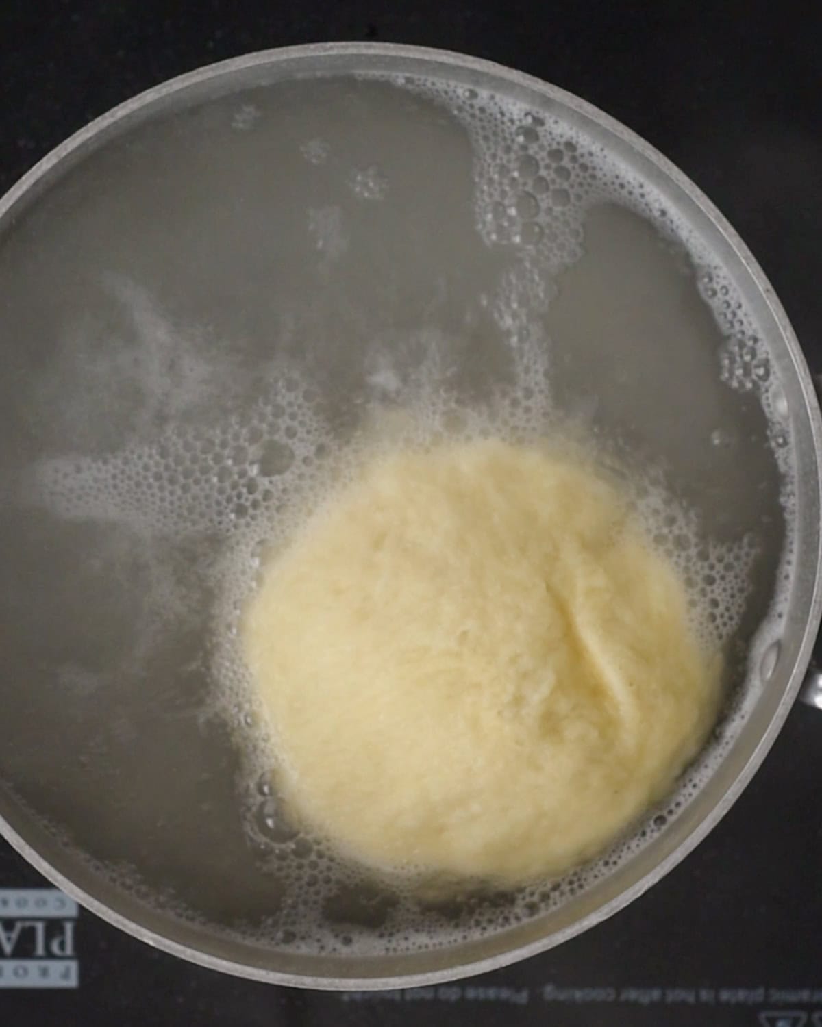 How to Make Pretzel Bread  - dough boiling in a baking soda water bath