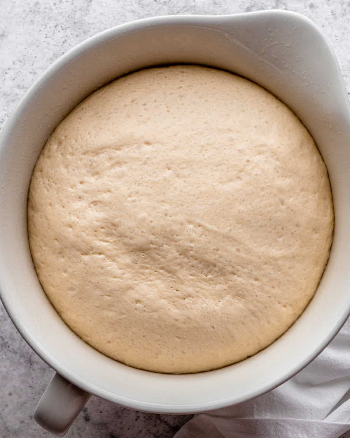 How to Make Pretzel Bread - dough in a bowl after rising