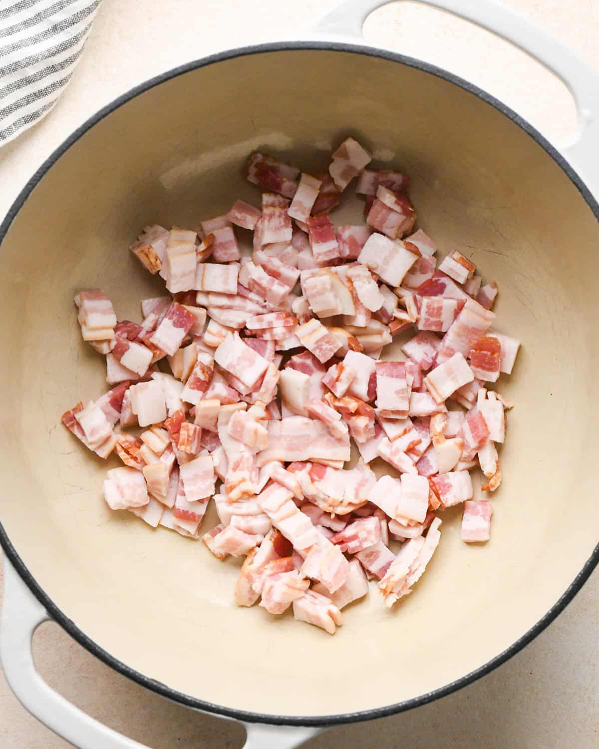 bacon in a pot before cooking