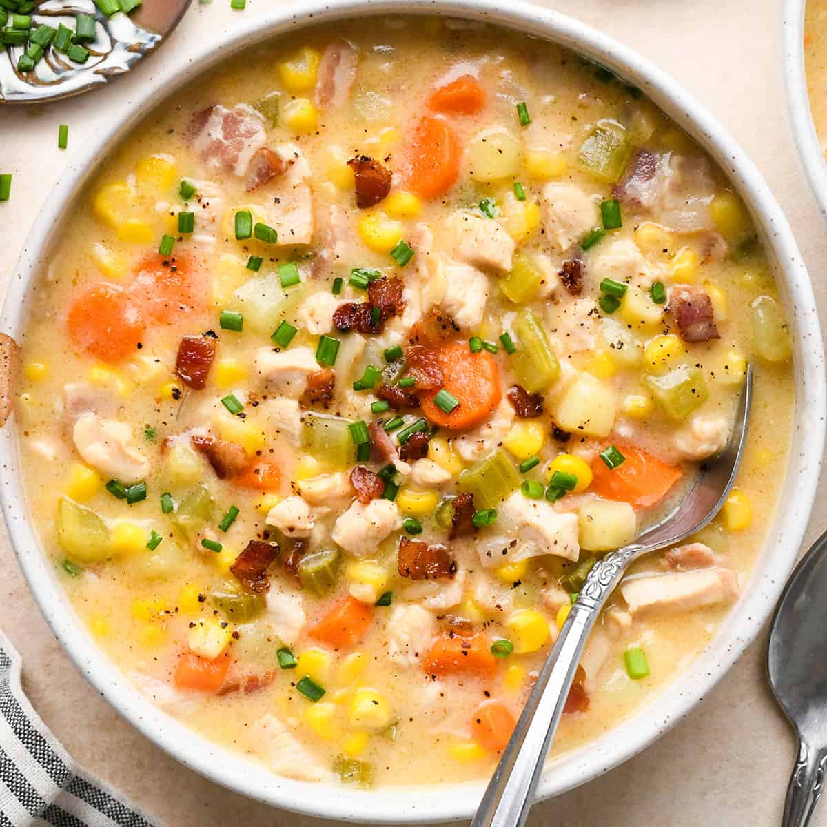 Sweet Corn & Chicken Soup in a bowl with a spoon