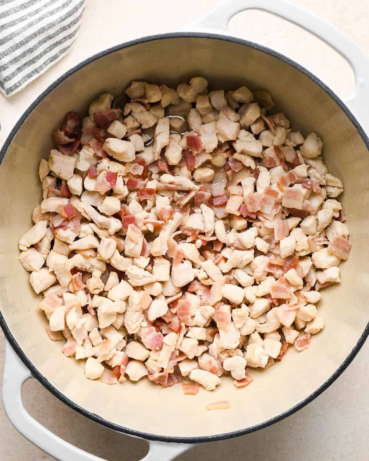 making Sweet Corn & Chicken Soup - cooked chicken and bacon in a pot