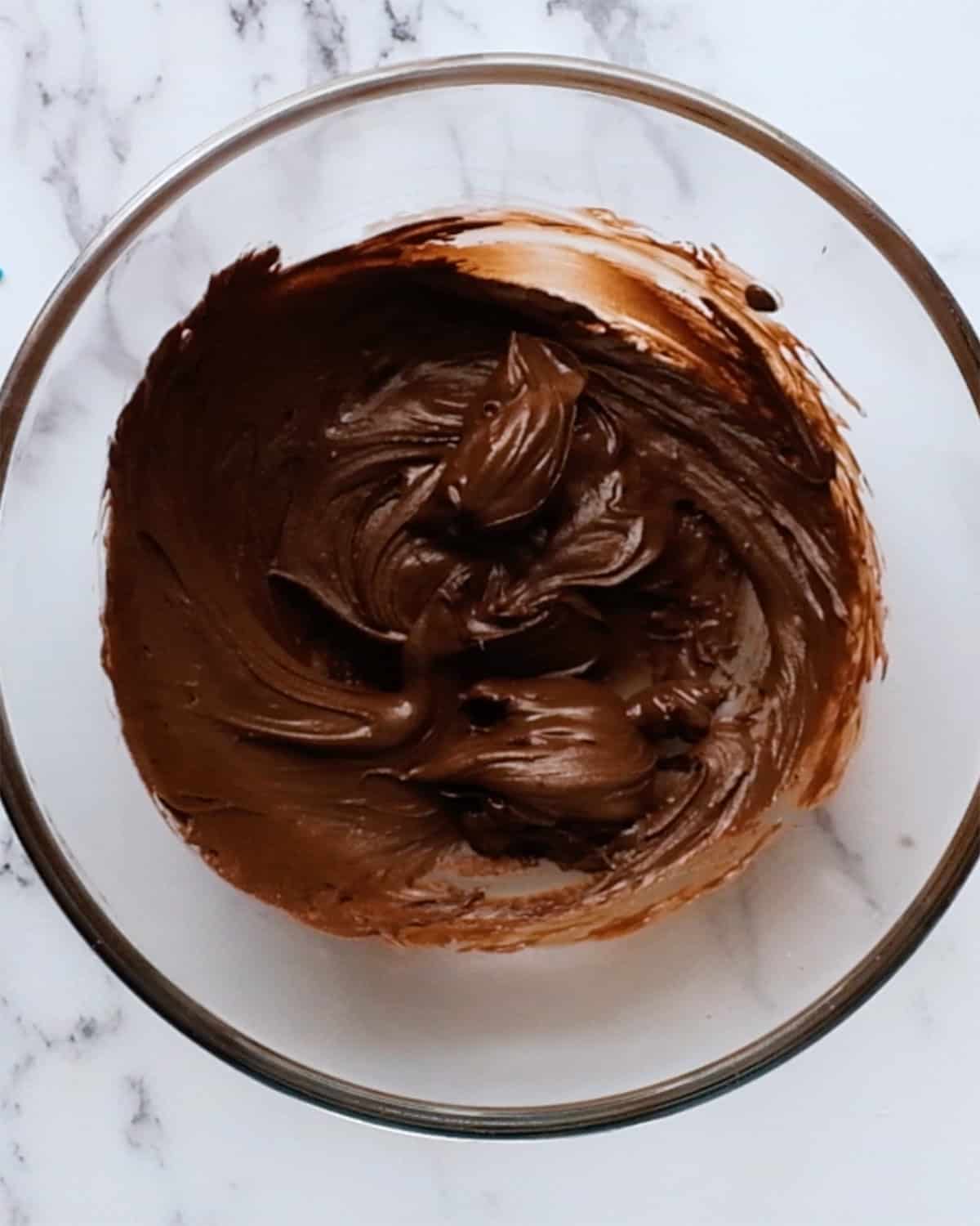 how to make almond butter blossoms-  melted chocolate in a bowl