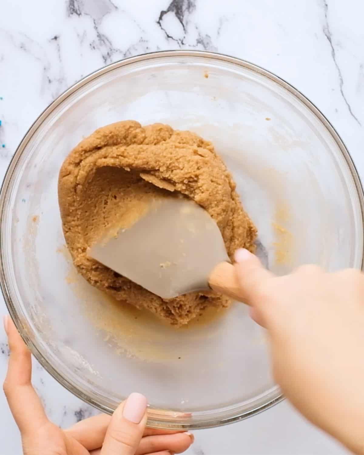 how to make almond butter blossoms - mixing dough in a bowl