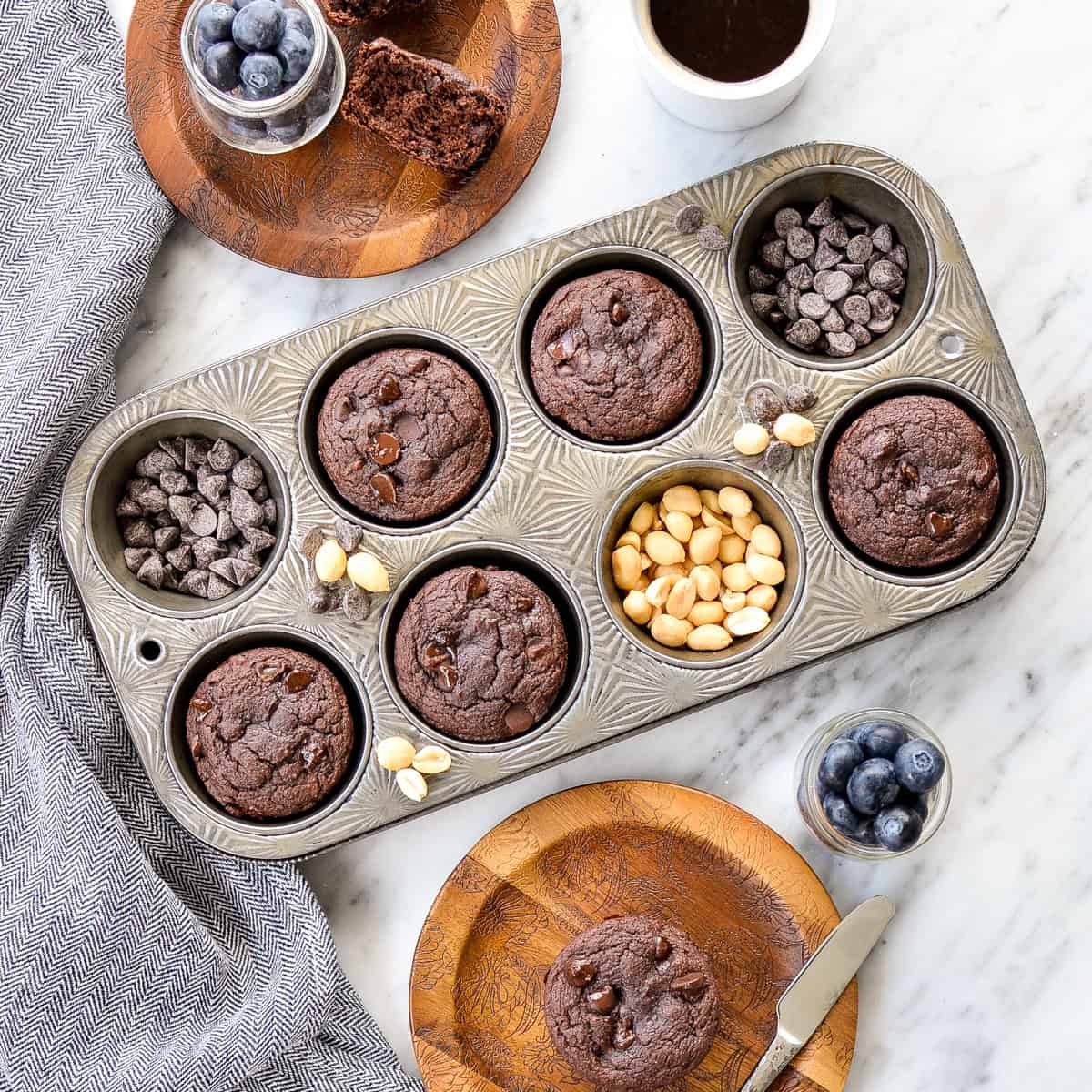 5 Chocolate Peanut Butter Zucchini Muffins in a muffin pan and 2 on plates