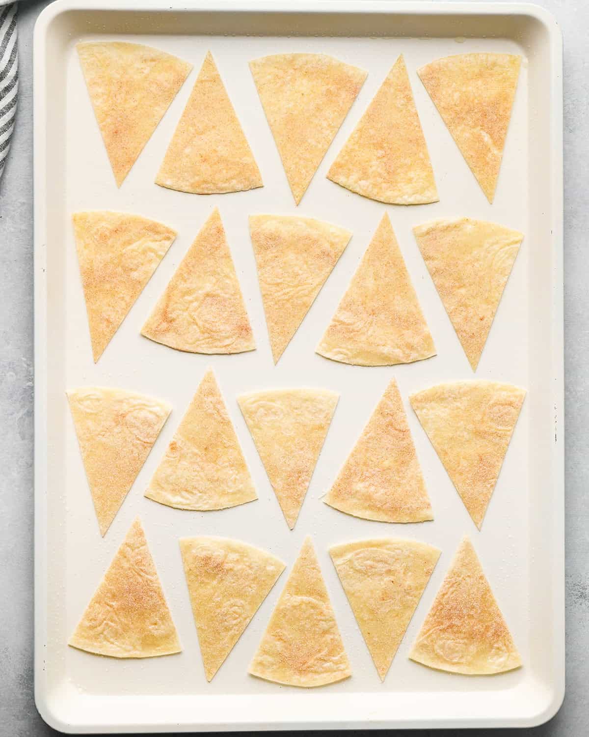 16 cinnamon tortilla chips on a baking pan before making