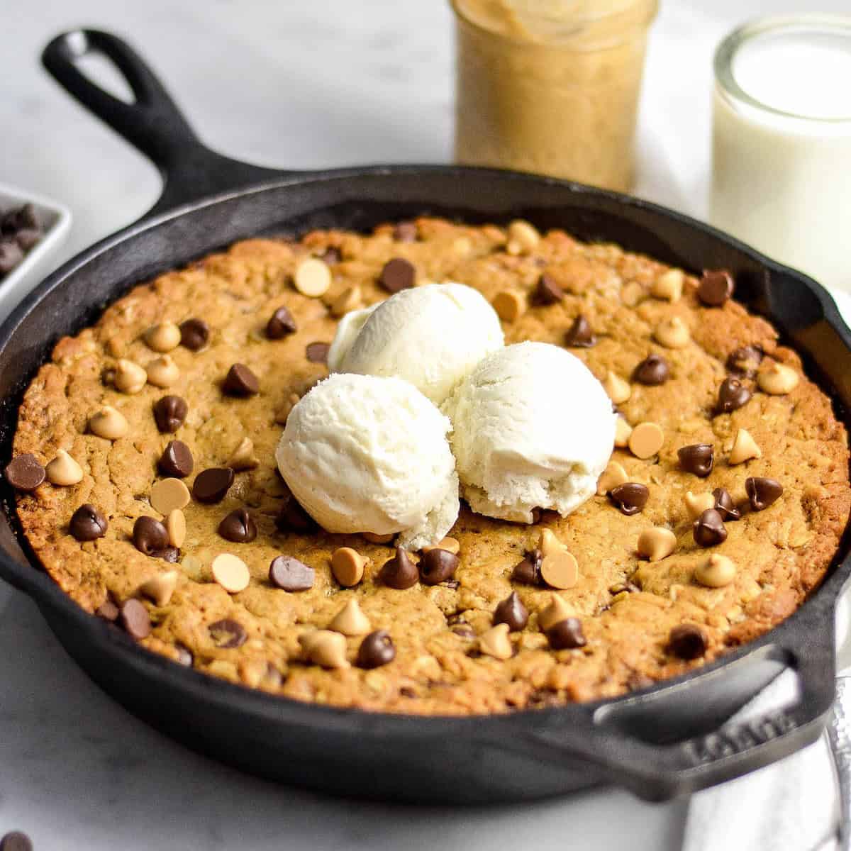 front view of Skillet Peanut Butter Cookie with 3 scoops of vanilla ice cream