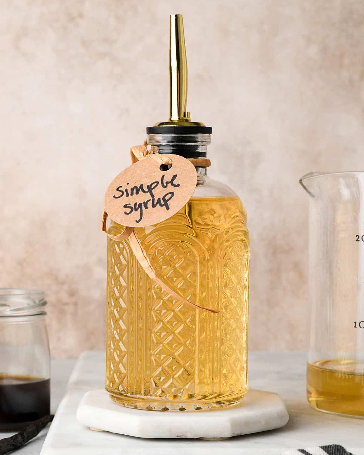 Simple Syrup Recipe in a glass bottle with a label