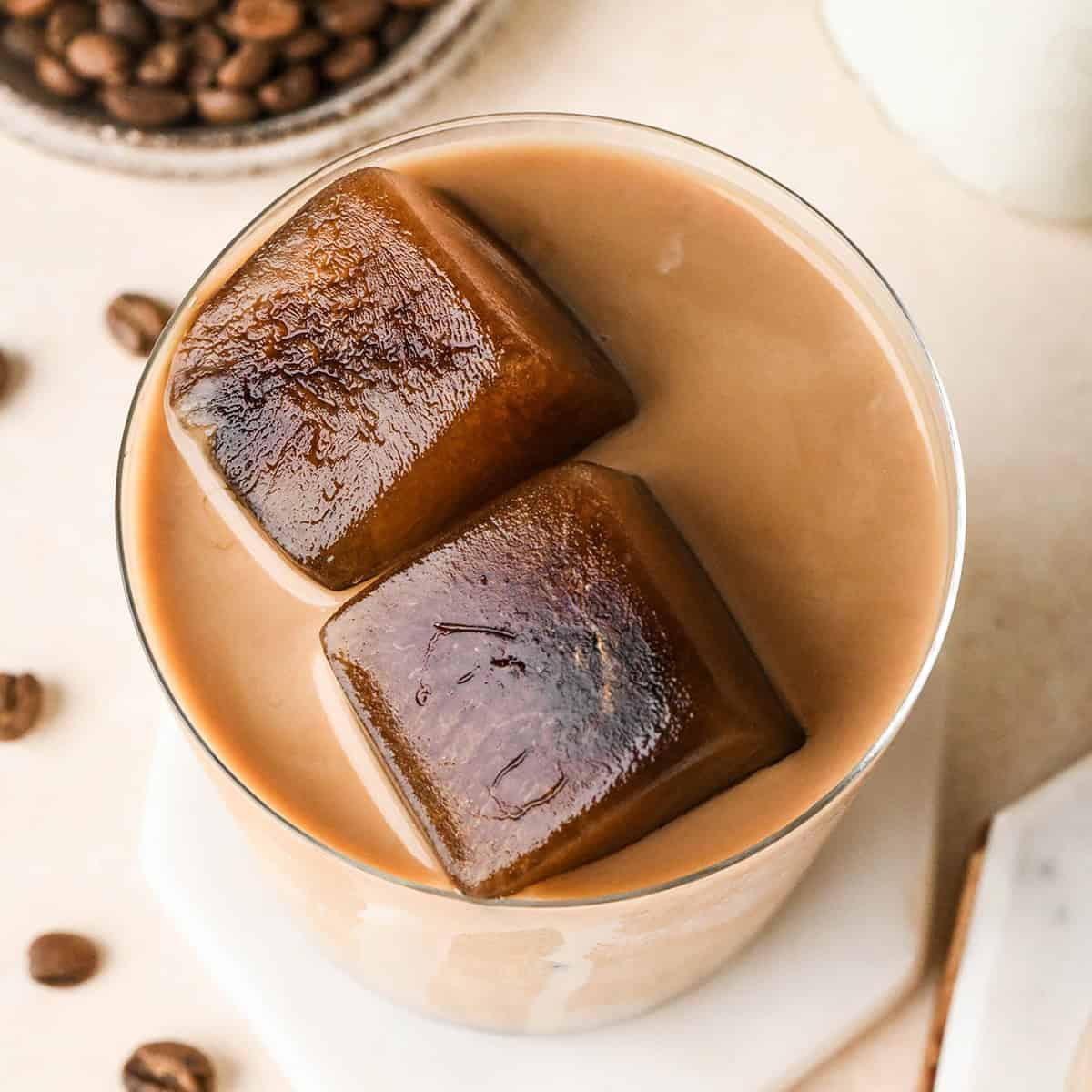 two Coffee Ice Cubes in a glass of iced coffee
