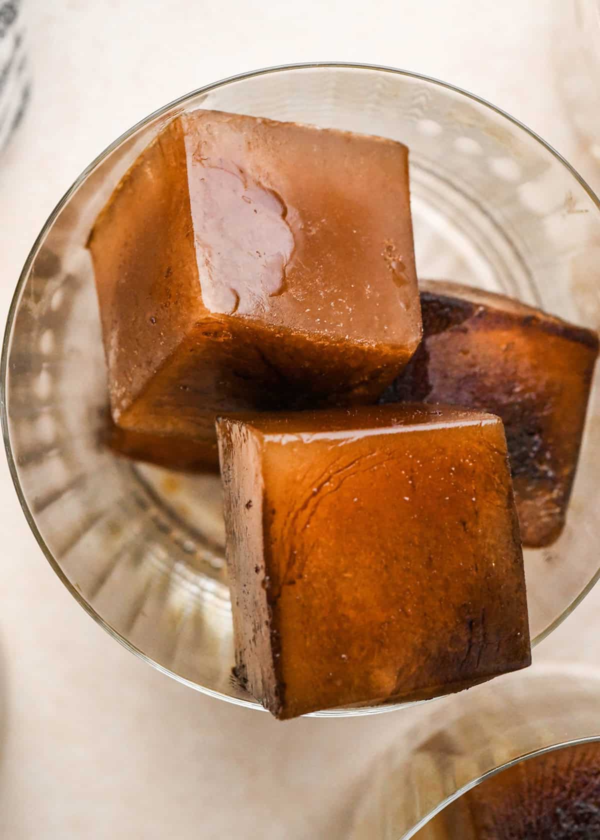 overhead photo of 3 Coffee Ice Cubes in a glass