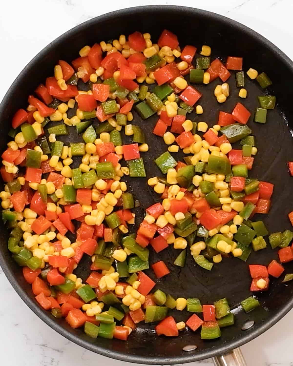 how to make gluten free crustless quiche - bell peppers in a pan after cooking