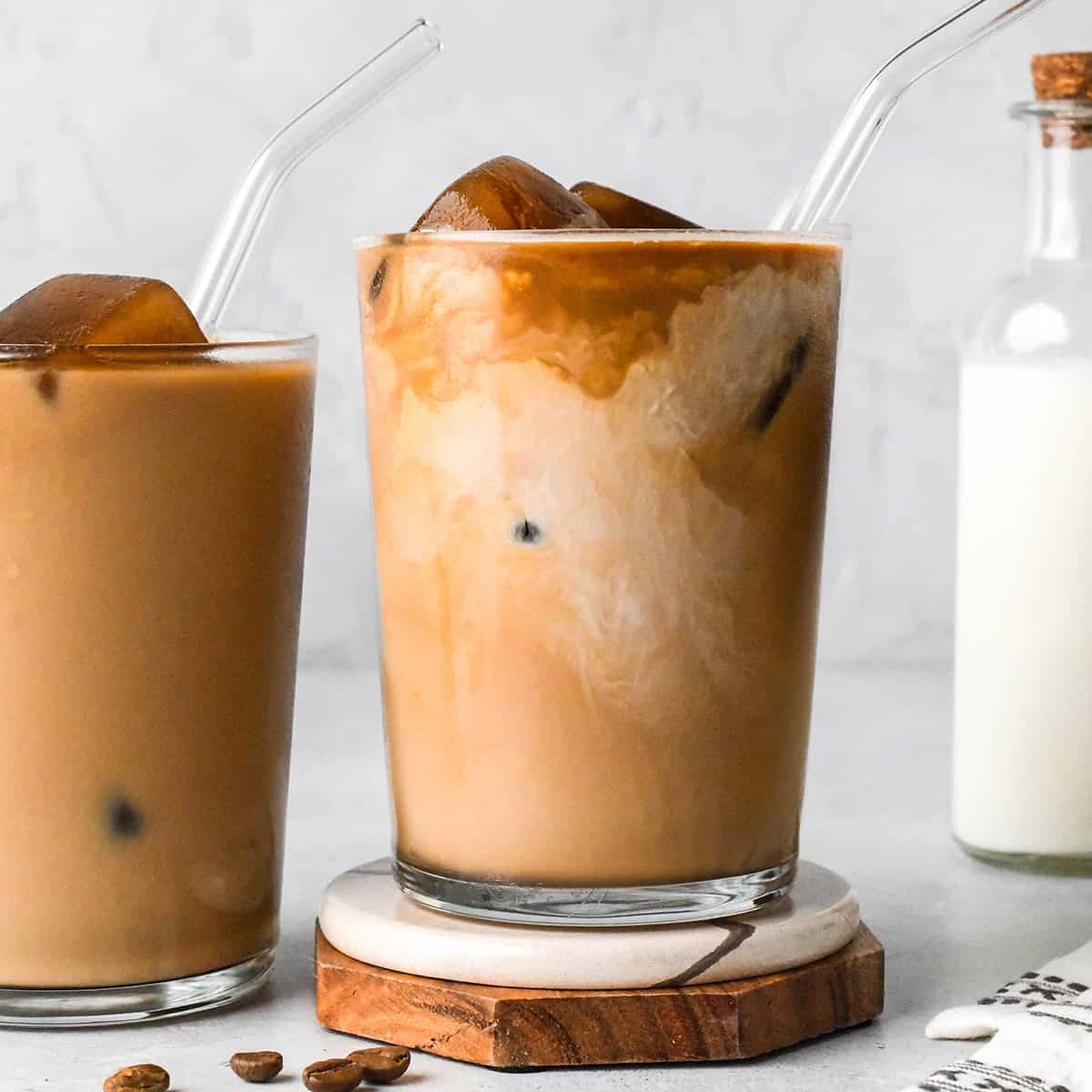 two glasses of iced coffee with coffee ice cubes
