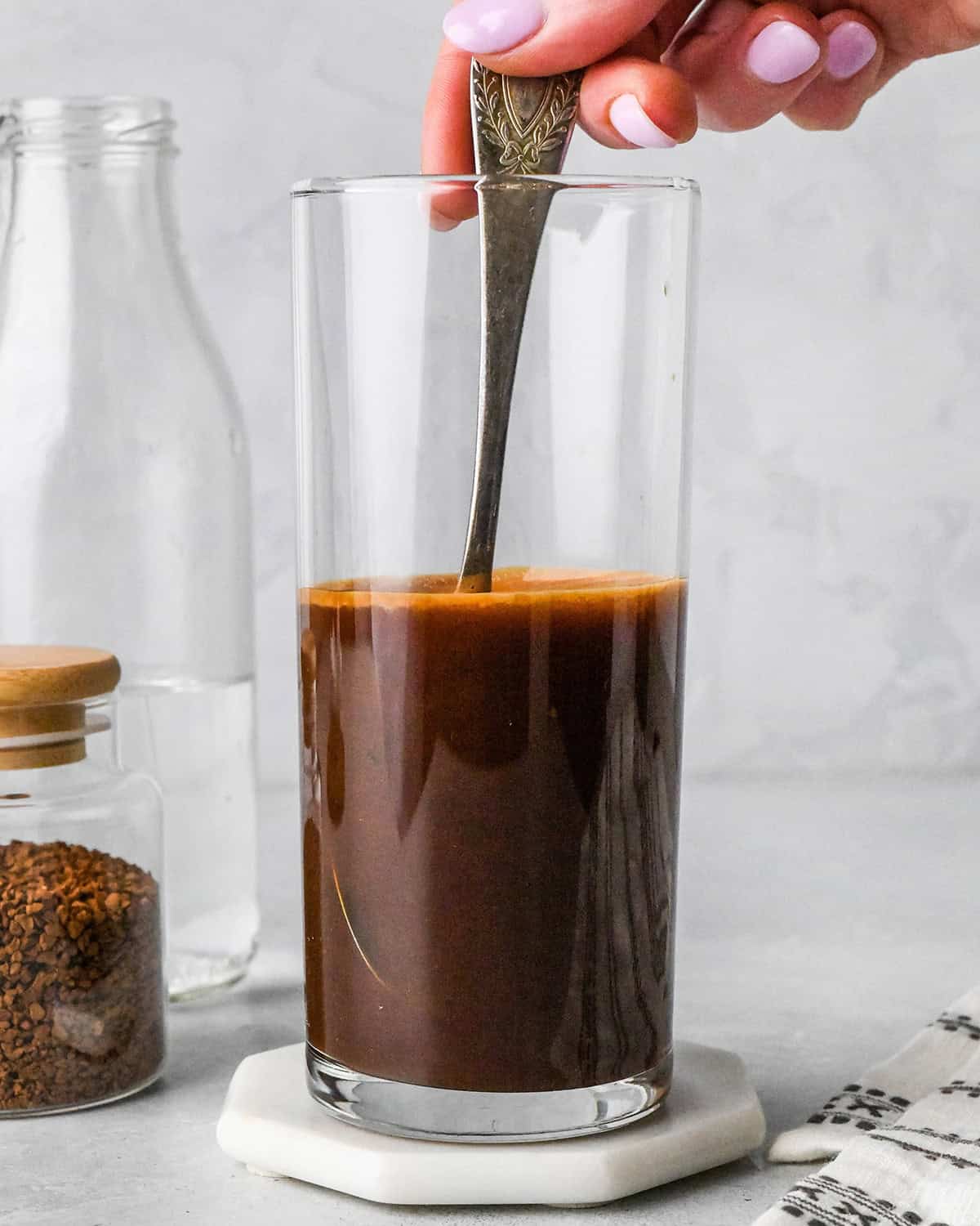 How to Make Iced Coffee - stirring water and instant coffee