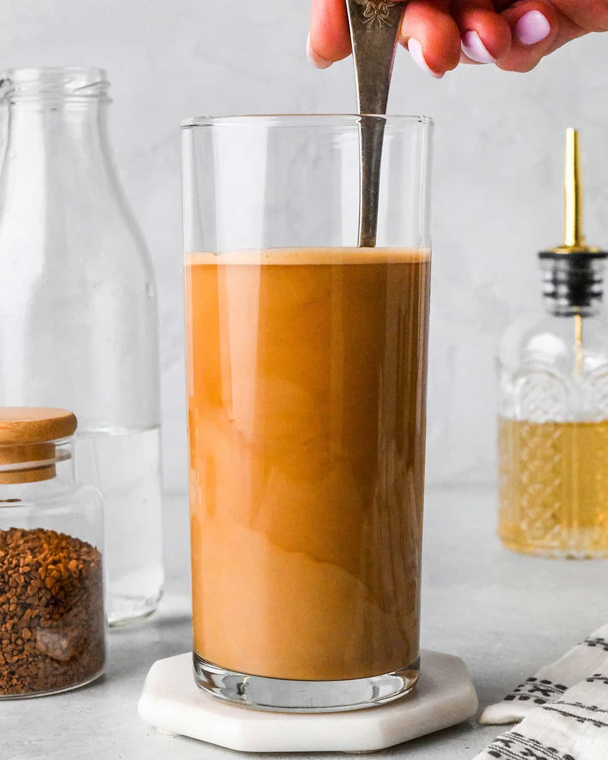 How to Make Iced Coffee stirring ingredients