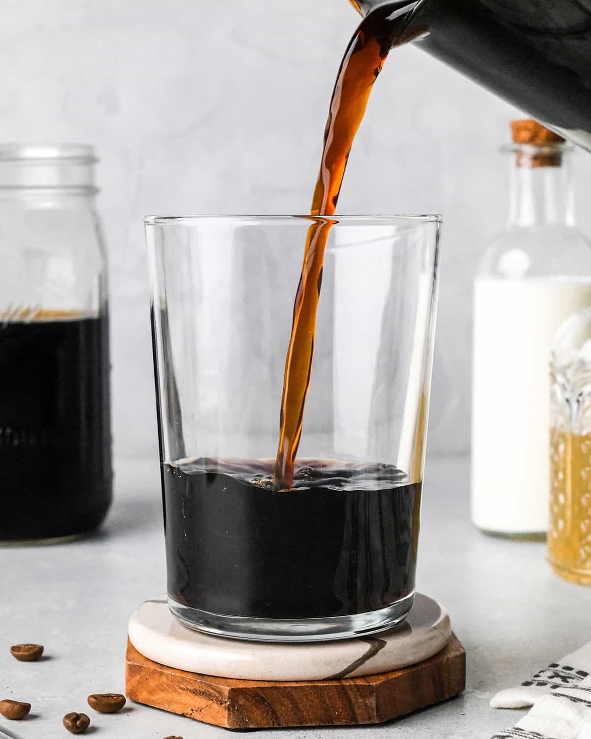 How to Make Iced Coffee with brewed coffee - pouring coffee into a glass