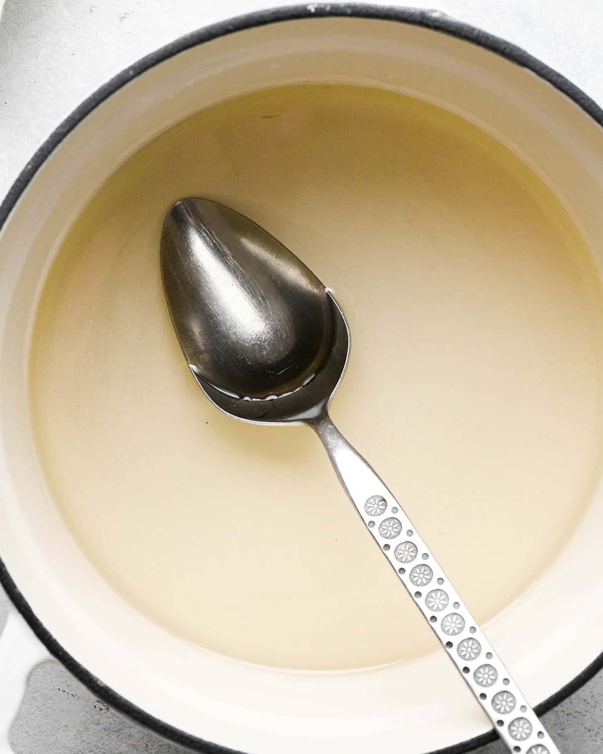 Simple Syrup Recipe in a pot with a spoon