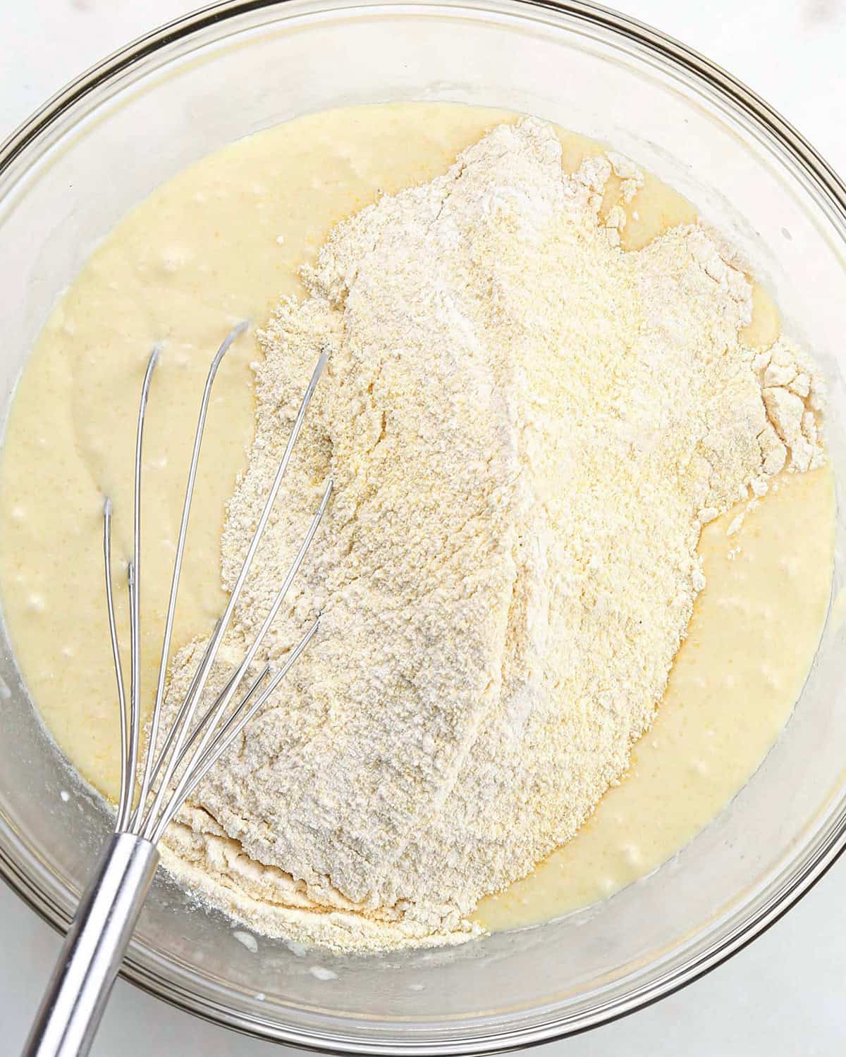 How to Make Skillet Cornbread - dry ingredients added to wet ingredients before whisking