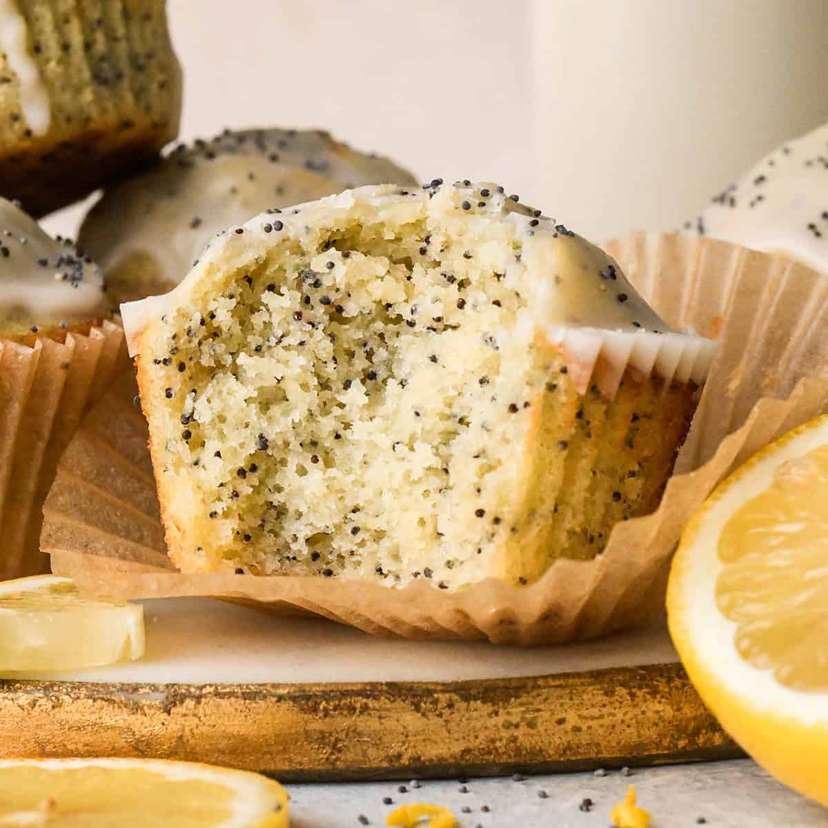 Lemon Poppy Seed Muffins, one with a bite taken out of it