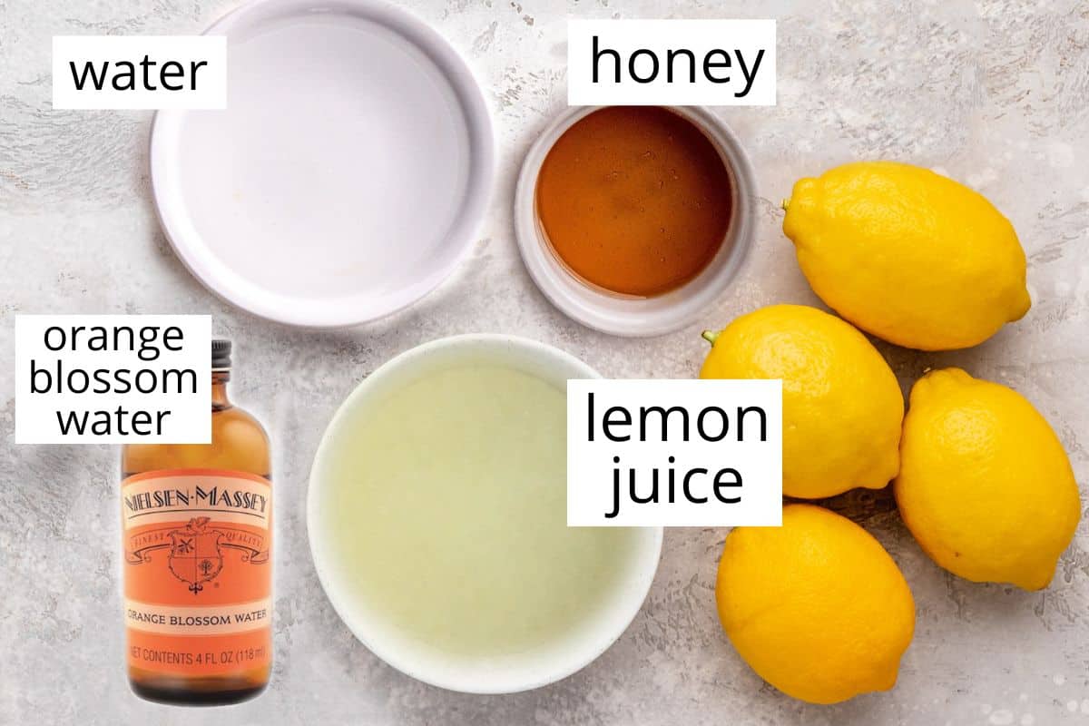 overhead photo of the labeled ingredients in this Orange Blossom Lemonade recipe