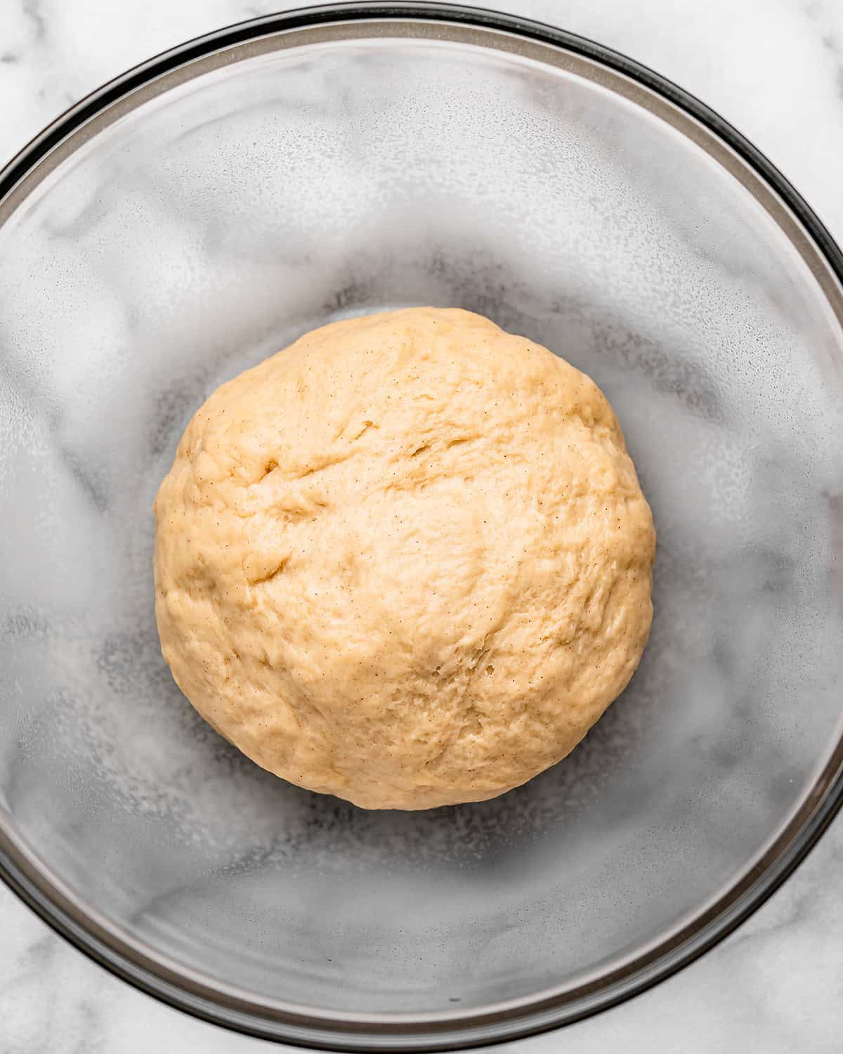 homemade resurrection roll dough in a bowl before rising