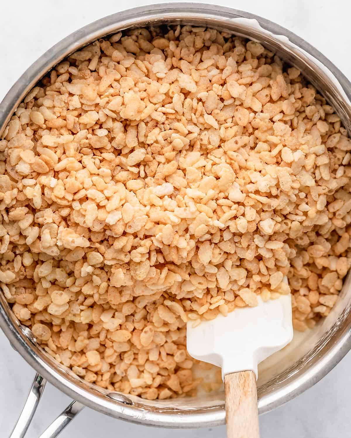how to make Rice Crispy Dessert Sushi - adding cereal before stirring