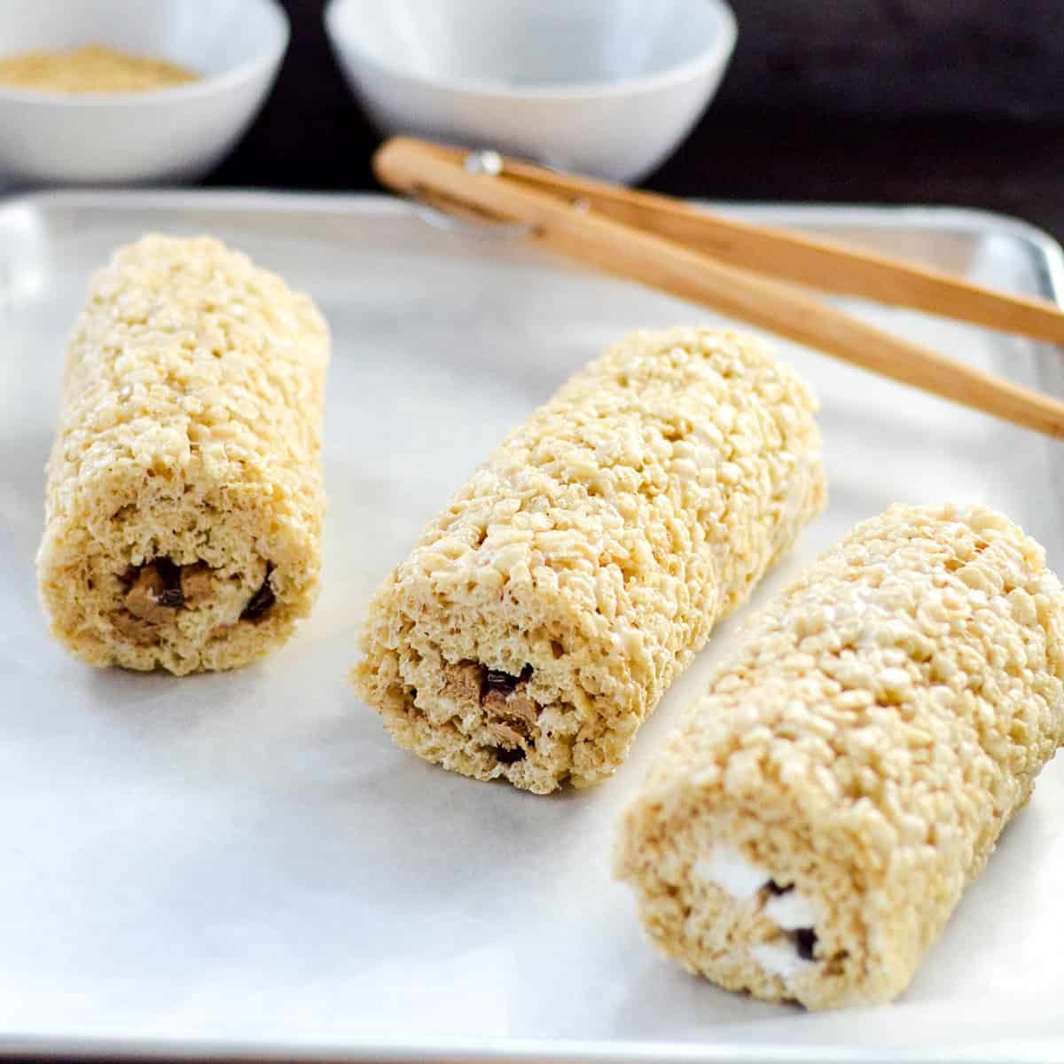 3 Rice Crispy Dessert Sushi rolls on a baking sheet
