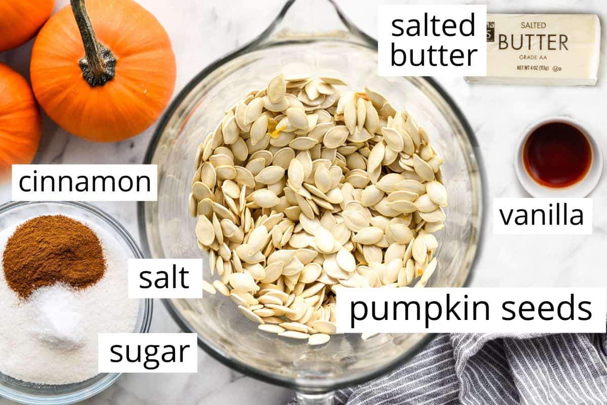 overhead photo of the labeled ingredients in this Cinnamon Sugar Pumpkin Seeds recipe