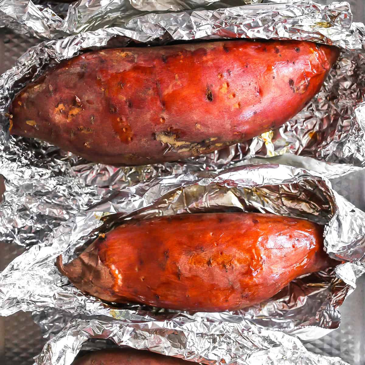 two sweet potatoes after roasting in foil 