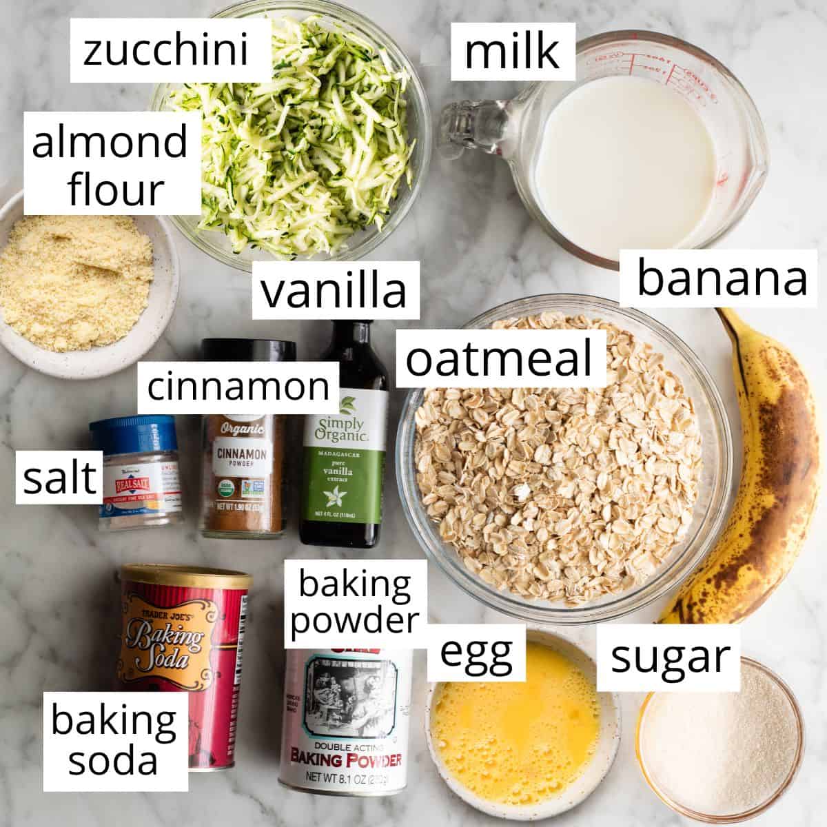 overhead photo of the labeled ingredients in this Zucchini Banana Pancakes Recipe