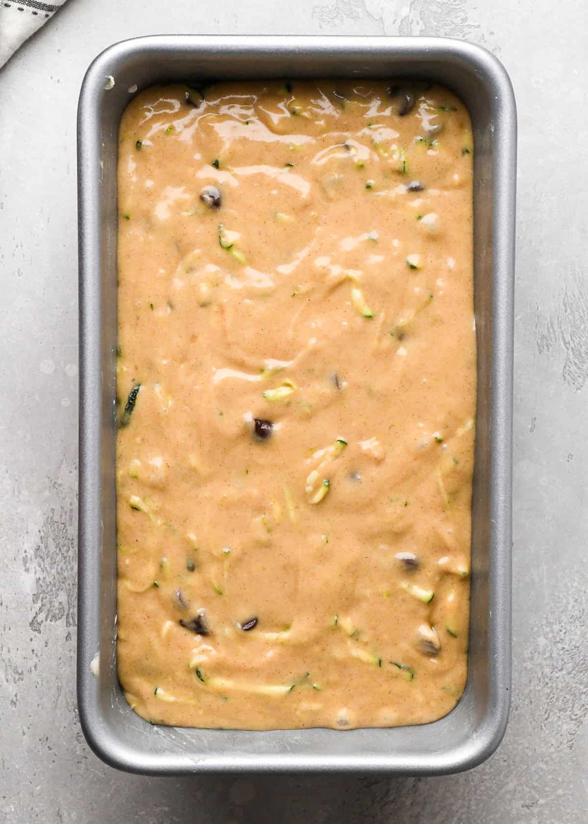 Chocolate Chip Zucchini Bread batter in a loaf pan before baking