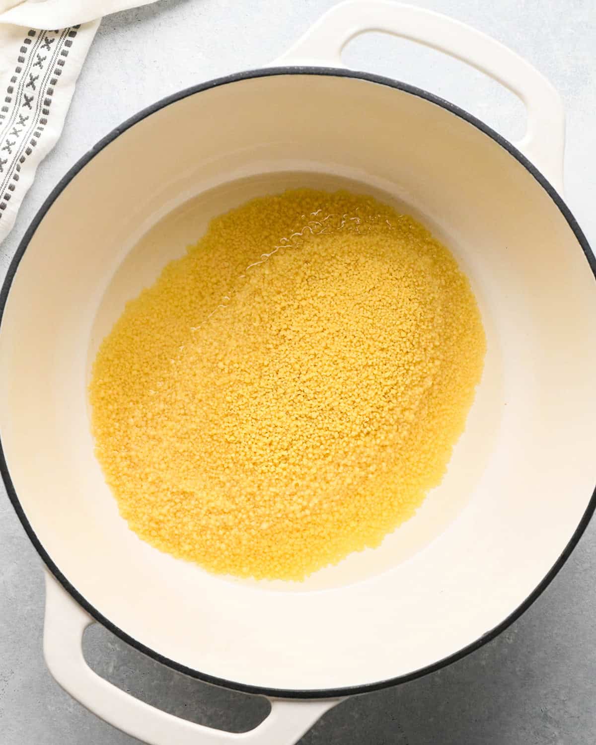 couscous added to salted water before stirring