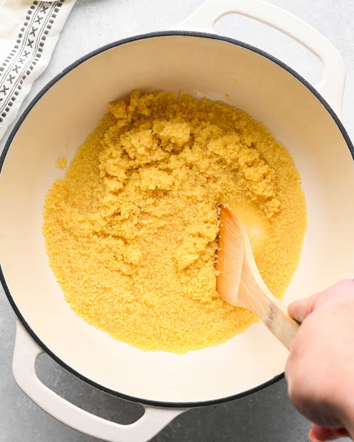 couscous being stirred into water