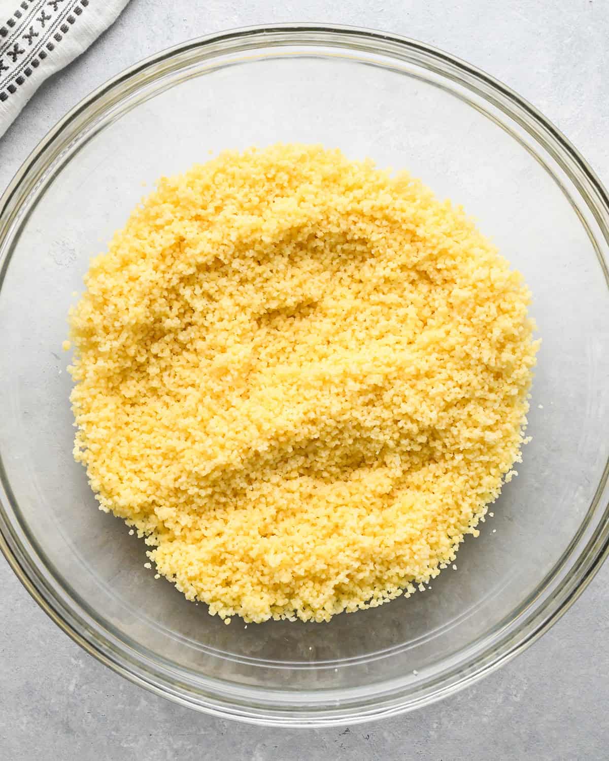 cooked couscous in a glass bowl