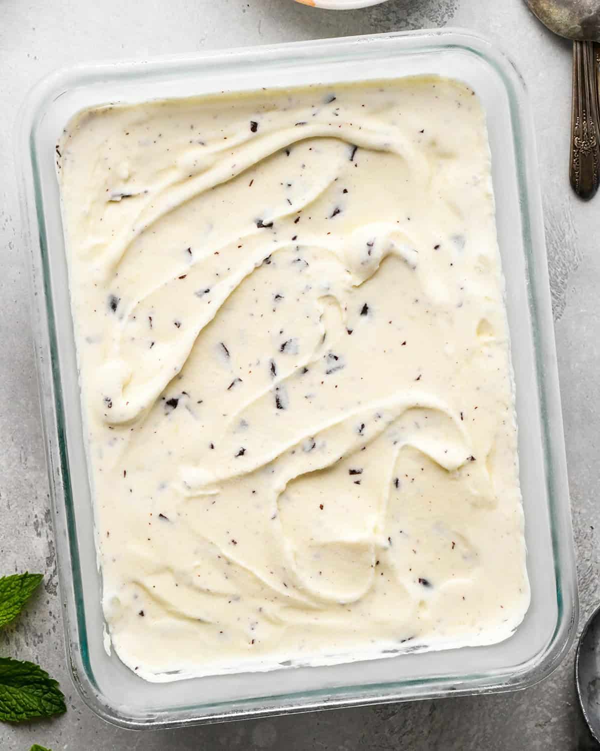 Mint Chocolate Chip Ice Cream in a glass container after freezing