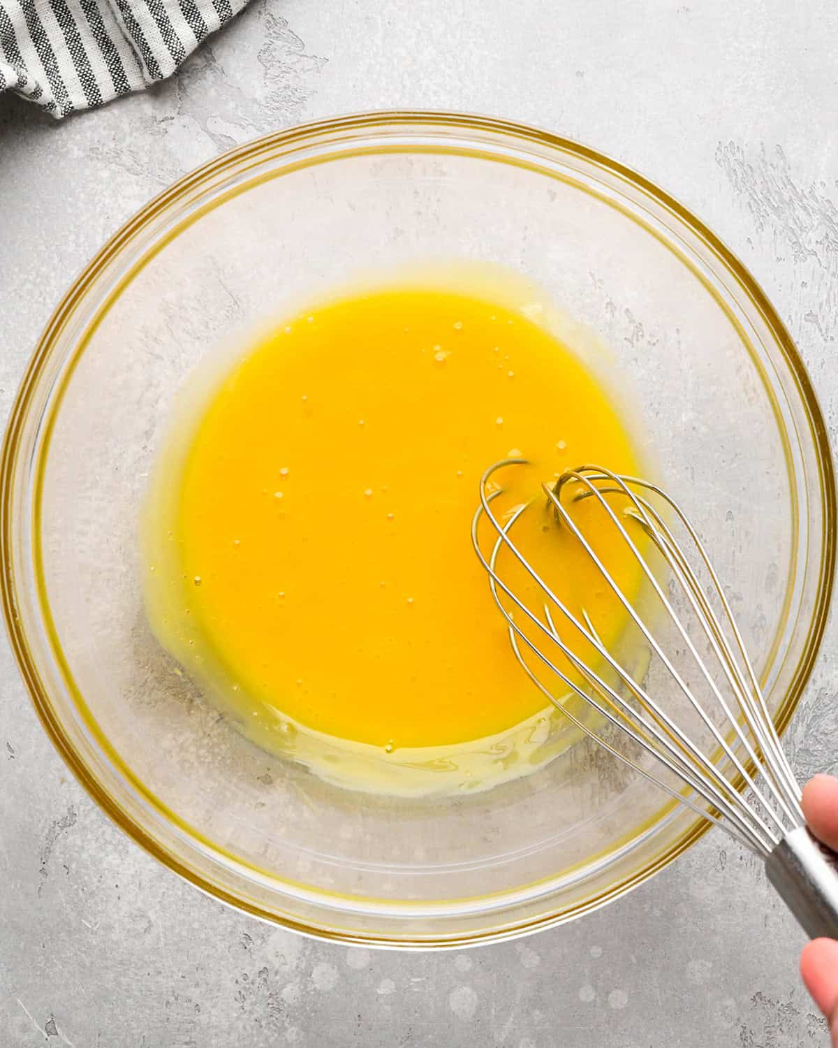 egg yolks whisked in a glass bowl