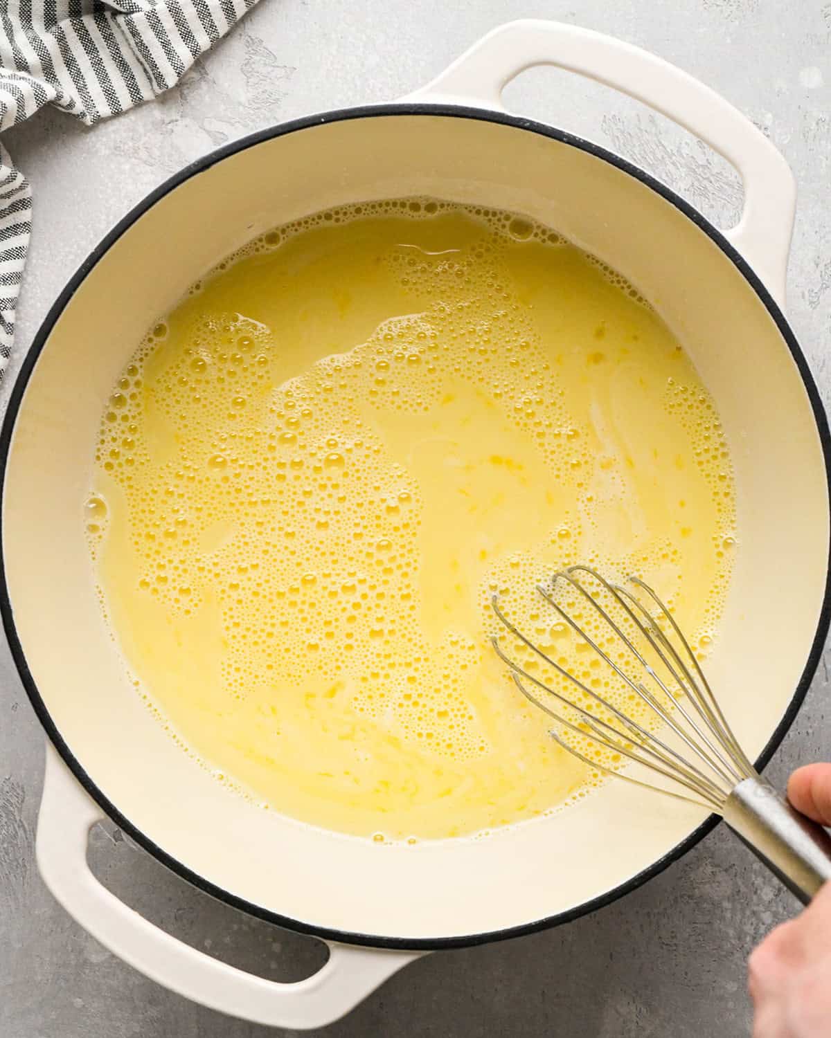 making Mint Chocolate Chip Ice Cream - whisking the custard together