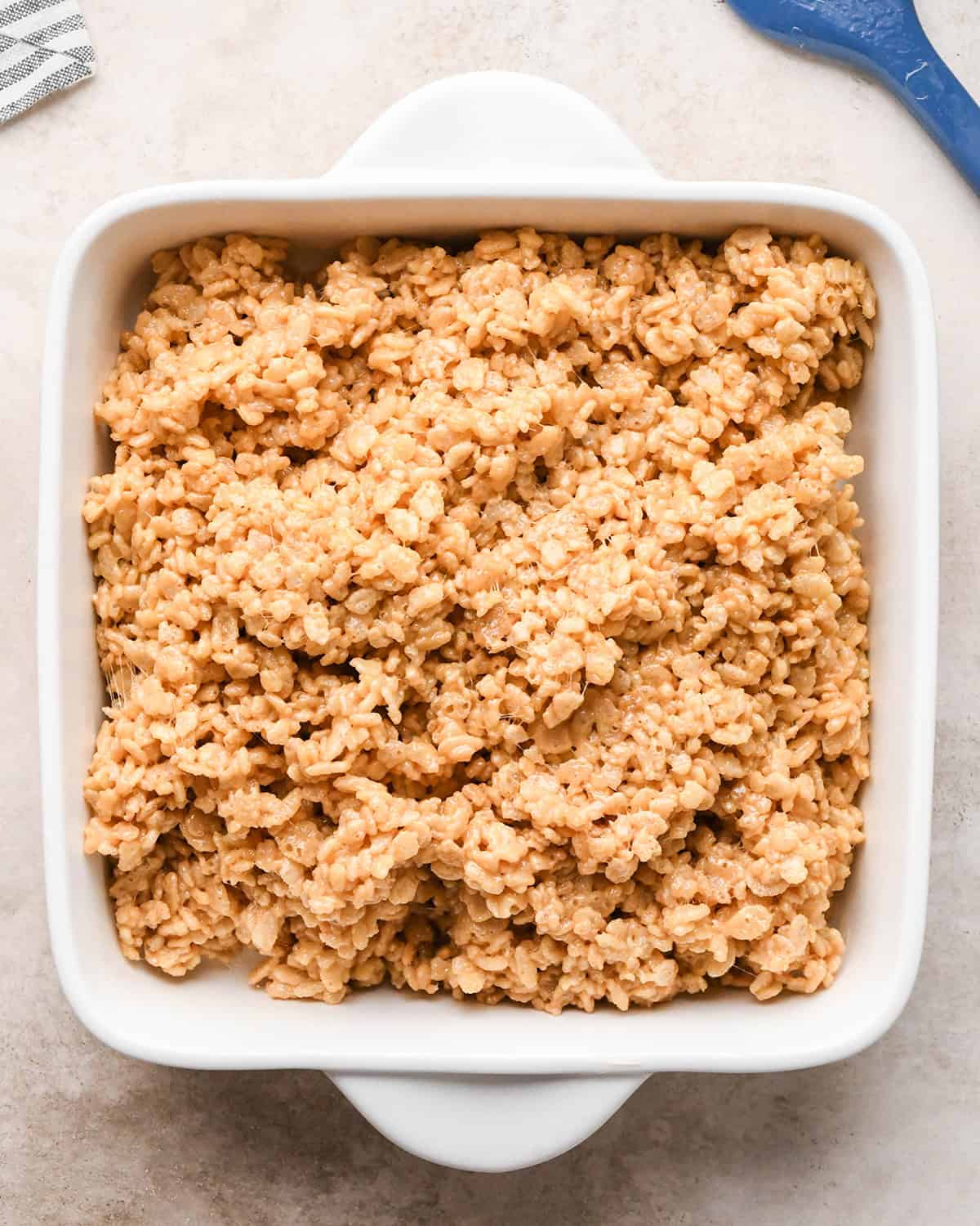 Peanut Butter Rice Crispy Treats mixture in a baking pan