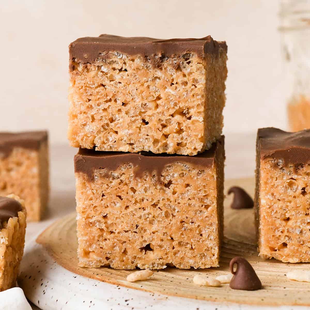 a stack of 2 Peanut Butter Rice Crispy Treats with others around it