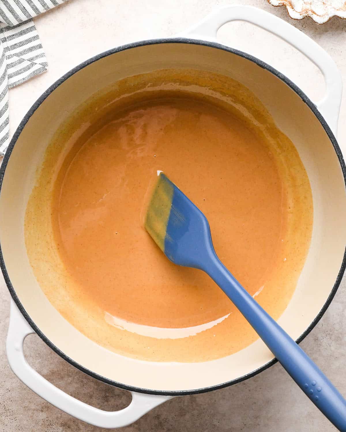 making Peanut Butter Rice Crispy Treats - butter and peanut butter in a pan after melting