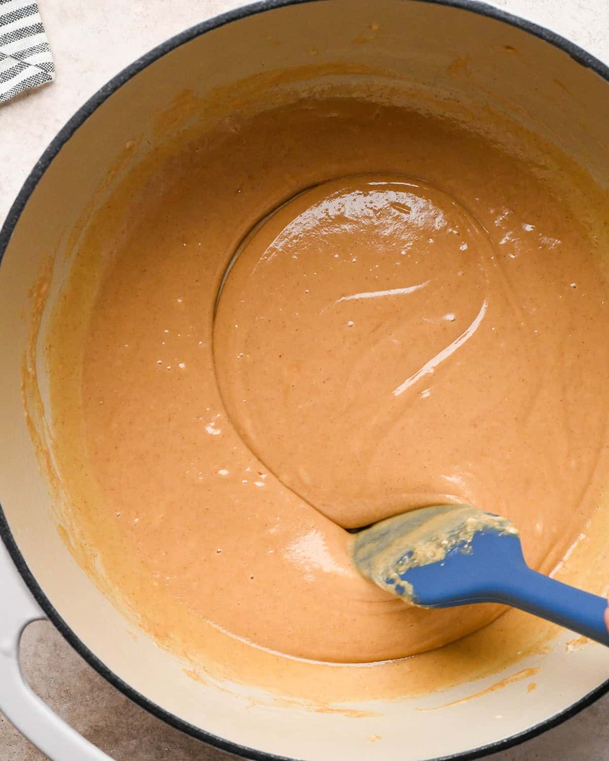 making Peanut Butter Rice Crispy Treats - stirring smooth peanut butter marshmallow mixture