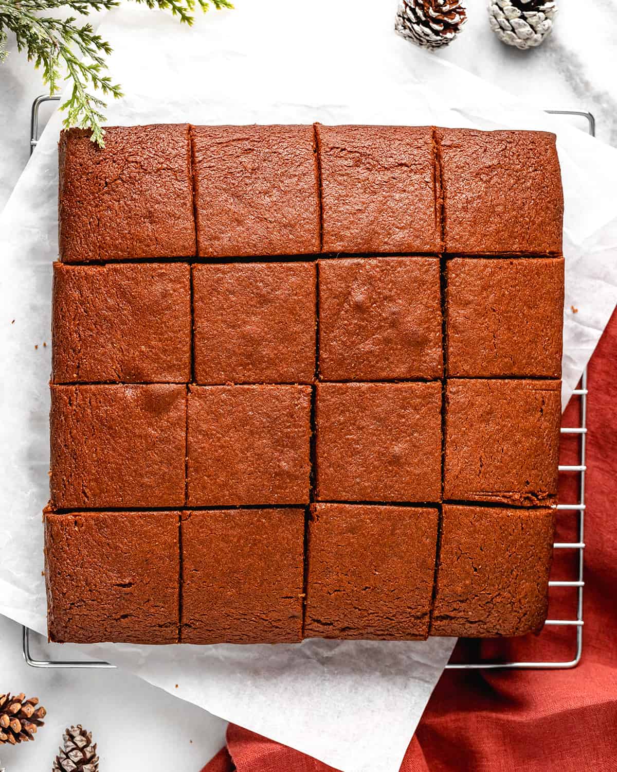 gingerbread cut into 16 squares on a wire cooling rack