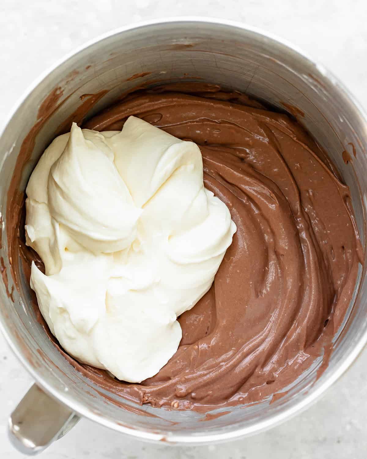 How to Make Dirt Cups - whipped cream added to chocolate pudding mixture before mixing