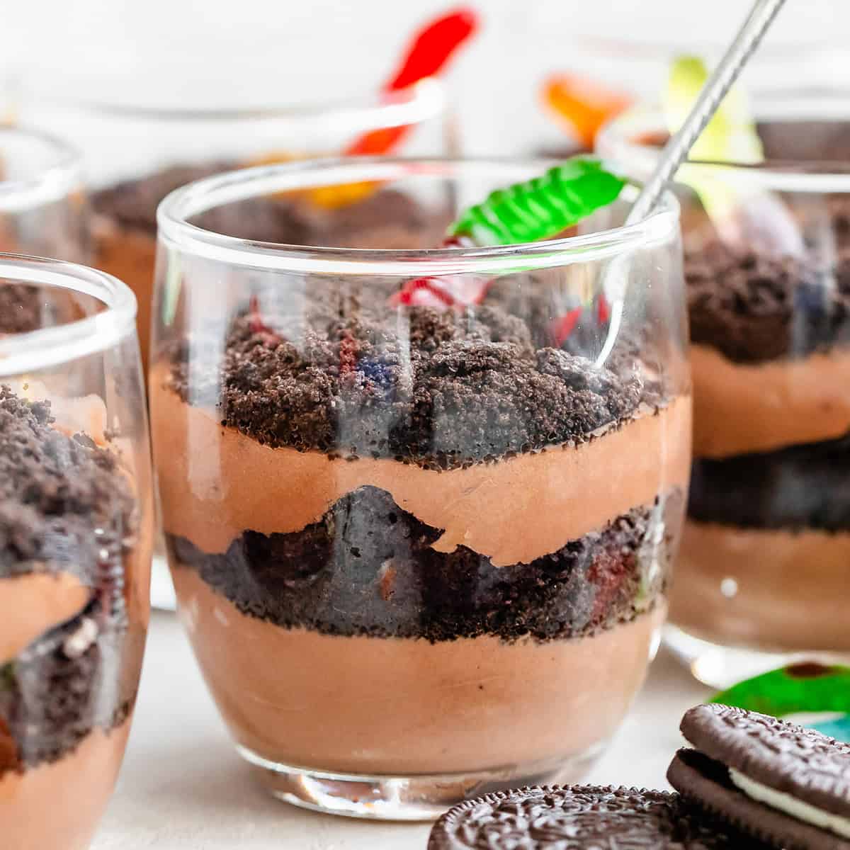 4 Dirt Cups with chocolate pudding and gummy worms