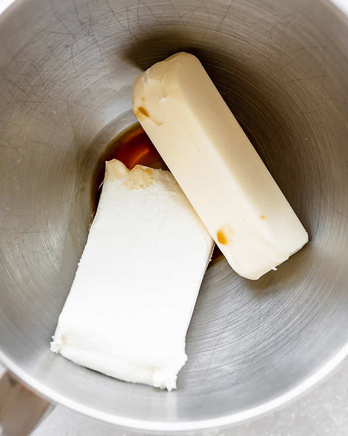 How to Make Dirt Cups - butter, vanilla and cream cheese in a bowl before beating