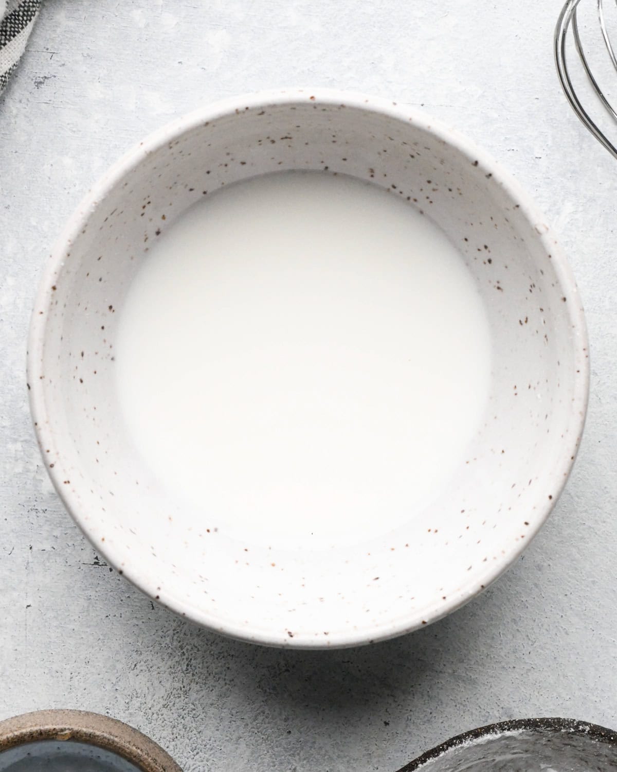 Making teriyaki sauce: overhead photo of cornstarch and water in a small bowl.