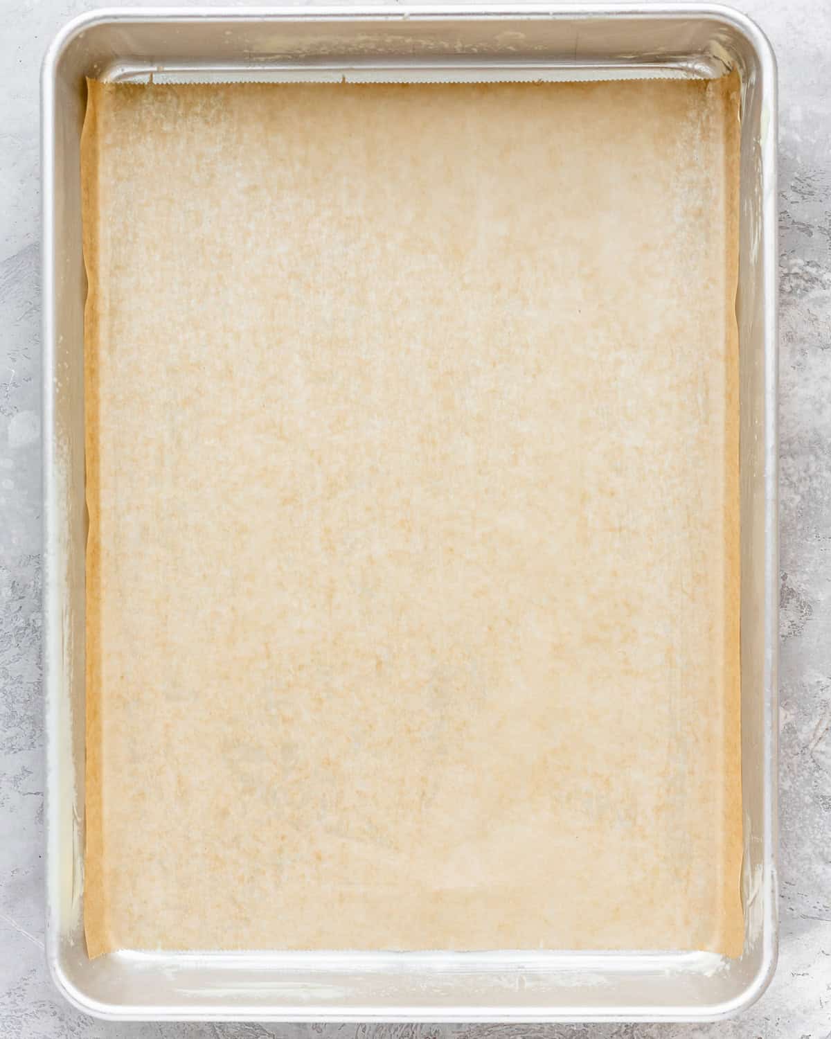 a large sheet cake pan lined with parchment paper 